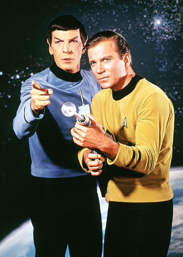 Spock and Kirk standing next to each other