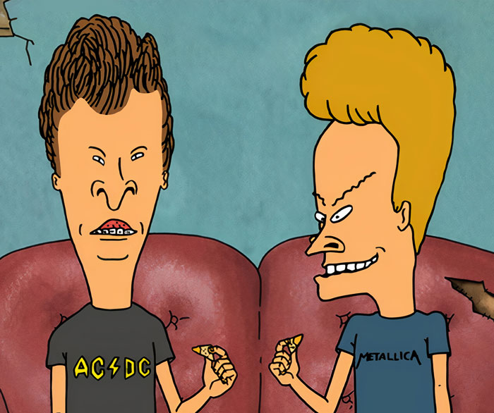 Beavis and B**t-Head sitting next to each other on the sofa and eating