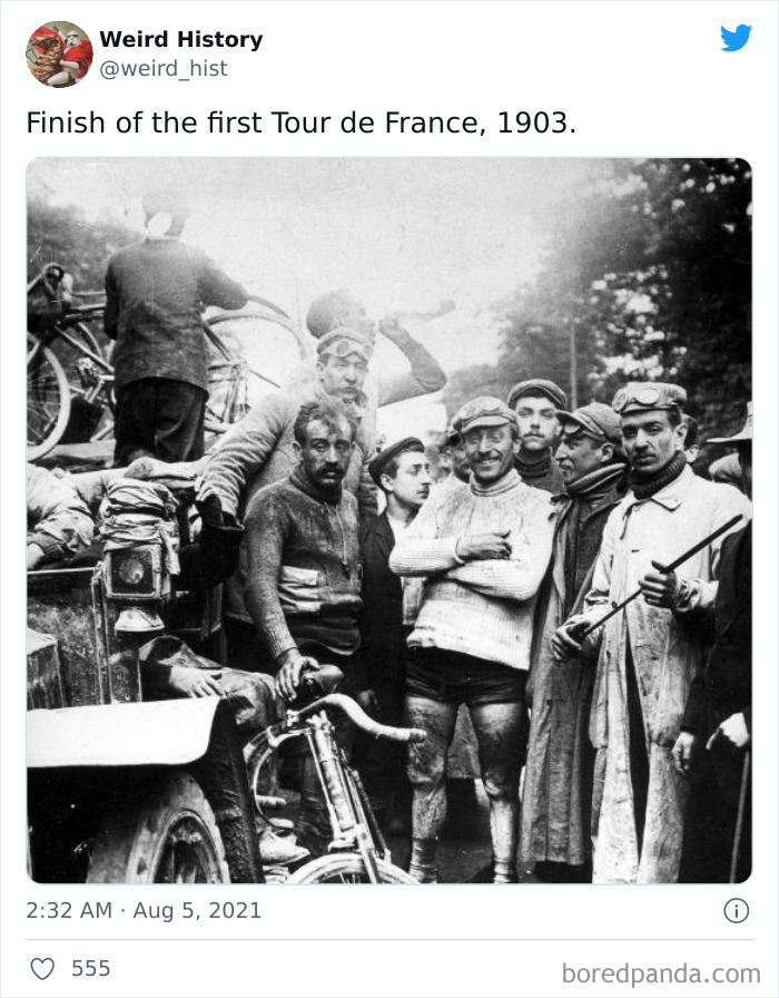 Black and white photo of cyclists and spectators at the finish of the first Tour de France, a weird history fact.