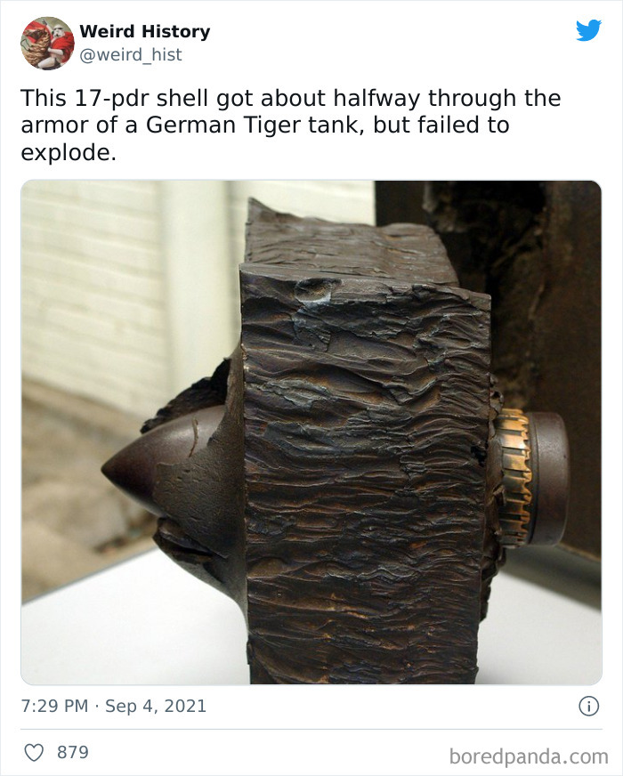 Close-up of a 17-pdr shell lodged in German Tiger tank armor showing a rare weird history military fact.