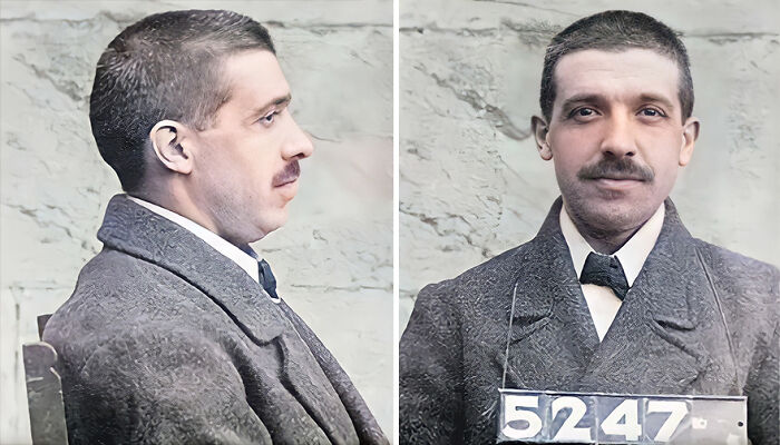 Restored vintage mugshot of a man in a suit with short hair and a mustache, showing front and side profiles.