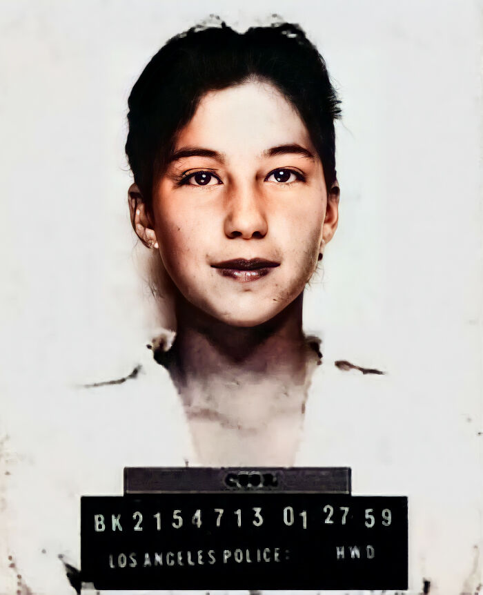 Restored vintage mugshot of a young woman from Los Angeles Police, showcasing old photograph restoration skills.