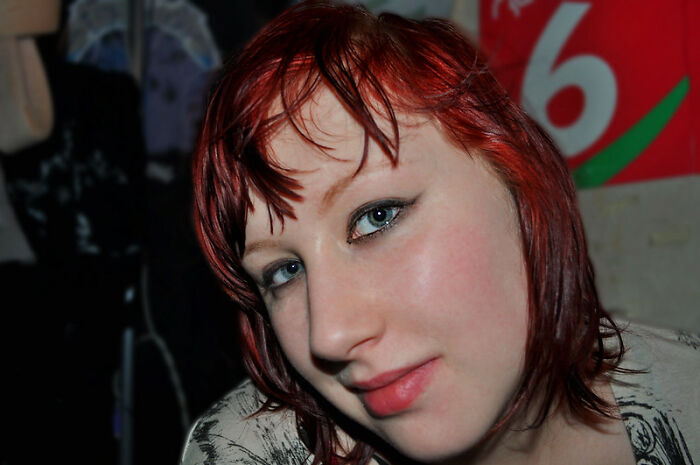 Young adult with red hair sharing advice in an online group about real world secrets and guidance for entering it