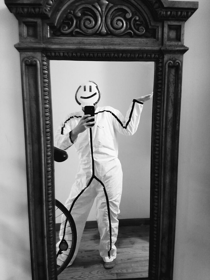 Person in a simple Halloween costume with a drawn smiley face and stick figure lines, showcasing easy costume ideas.