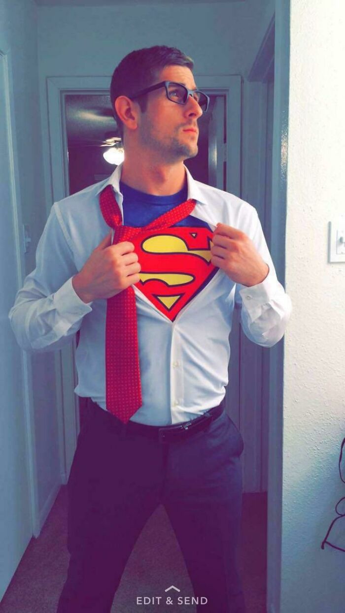 Man in glasses and red tie revealing Superman shirt inside for easy Halloween costume with minimal effort and great result