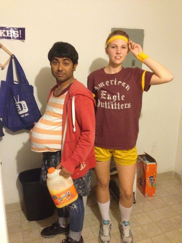 Two people in simple Halloween costumes, one with a fake belly and juice jug, the other in sporty attire, showing effort-free costume ideas.