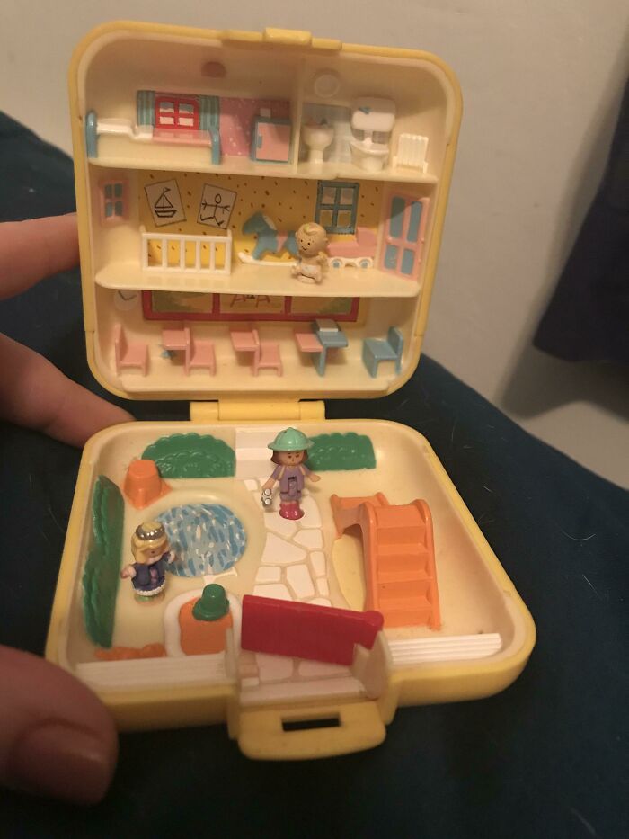 2000s Polly Pocket compact with a mini playground and figures, reflecting nostalgic toy trends.