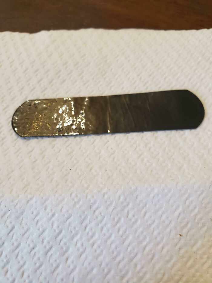 This Was In My Bandaid Wrapper Instead Of A Bandaid. Almost Rubbery. Solid Construction, Not Sticky, Same On Opposite Side