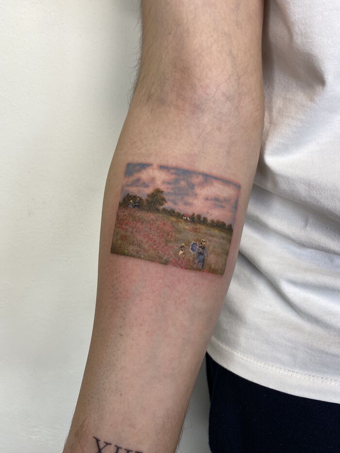 Intricate first tattoo of a landscape scene on forearm, showcasing detailed artistry.