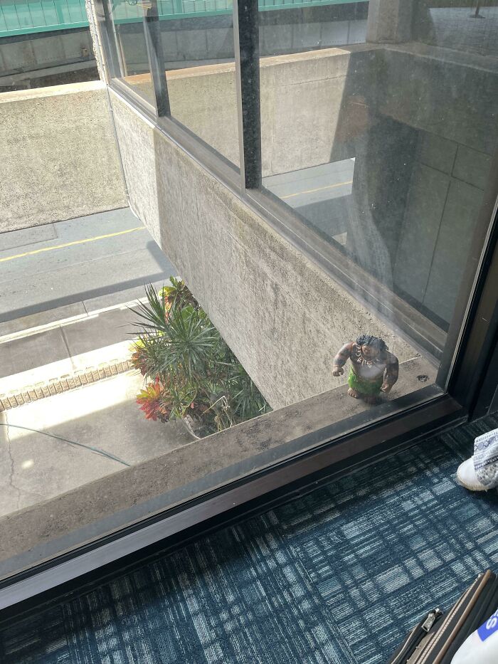 Maui Statue Outside A Window In The Maui Airport