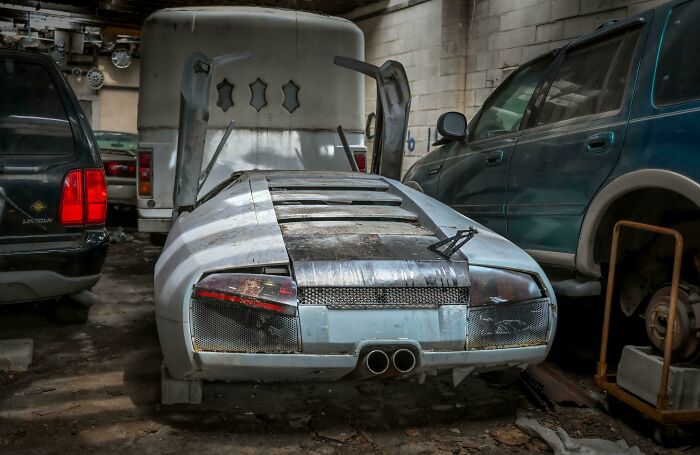 An Abandoned Lambo In An Auto Garage