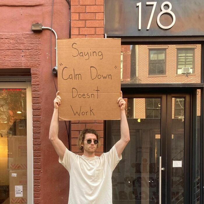 Funny-Dude-Holding-Signs-Protesting