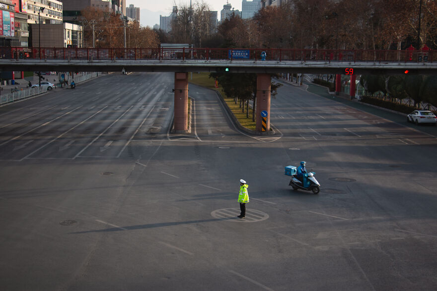Possibly The Busiest Intersection In The City, Now Just Delivery Guys And Bored Police