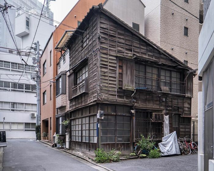 Traditional old architecture in Japan stands amid modern buildings, showcasing the balance between old and new property styles.