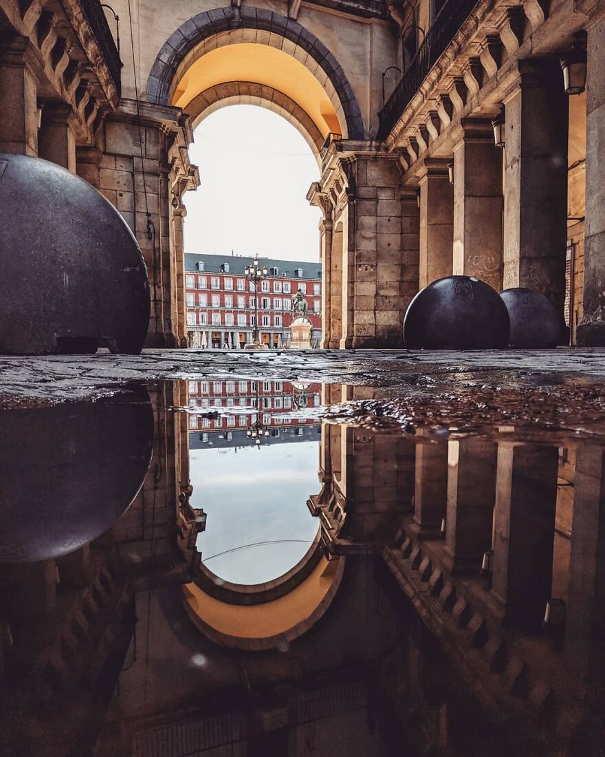 Unusual Pictures Of The Beauty Of Madrid Through Reflections And Puddles