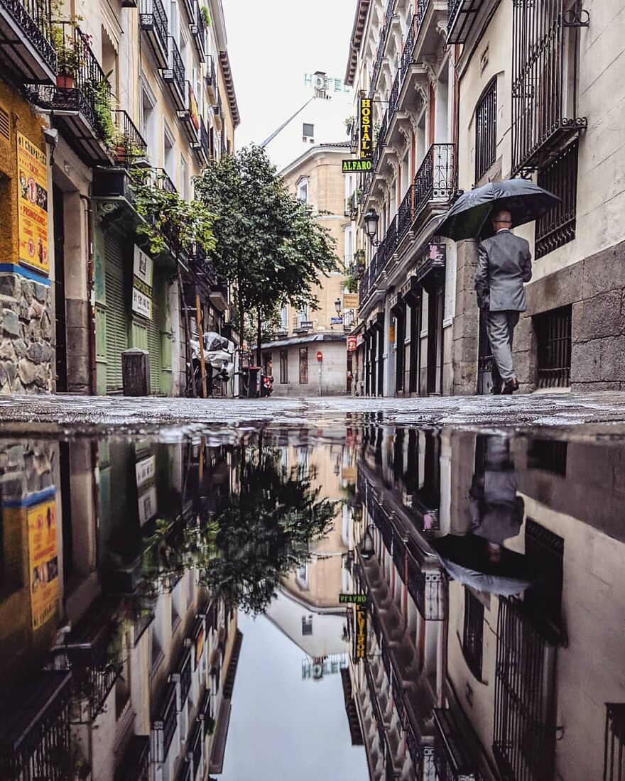 Unusual Pictures Of The Beauty Of Madrid Through Reflections And Puddles