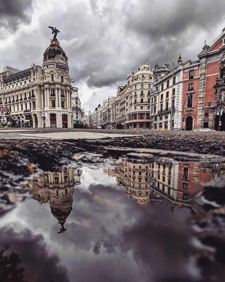 Unusual Pictures Of The Beauty Of Madrid Through Reflections And Puddles