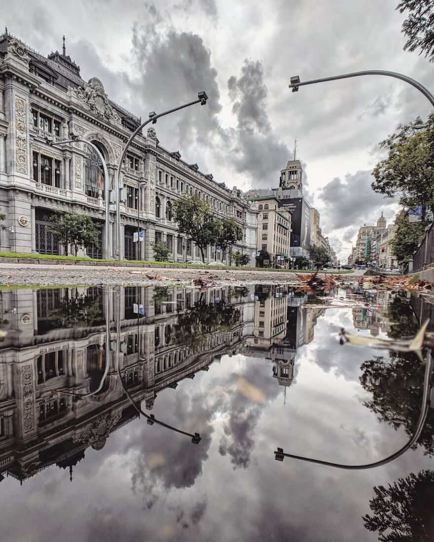 Unusual Pictures Of The Beauty Of Madrid Through Reflections And Puddles