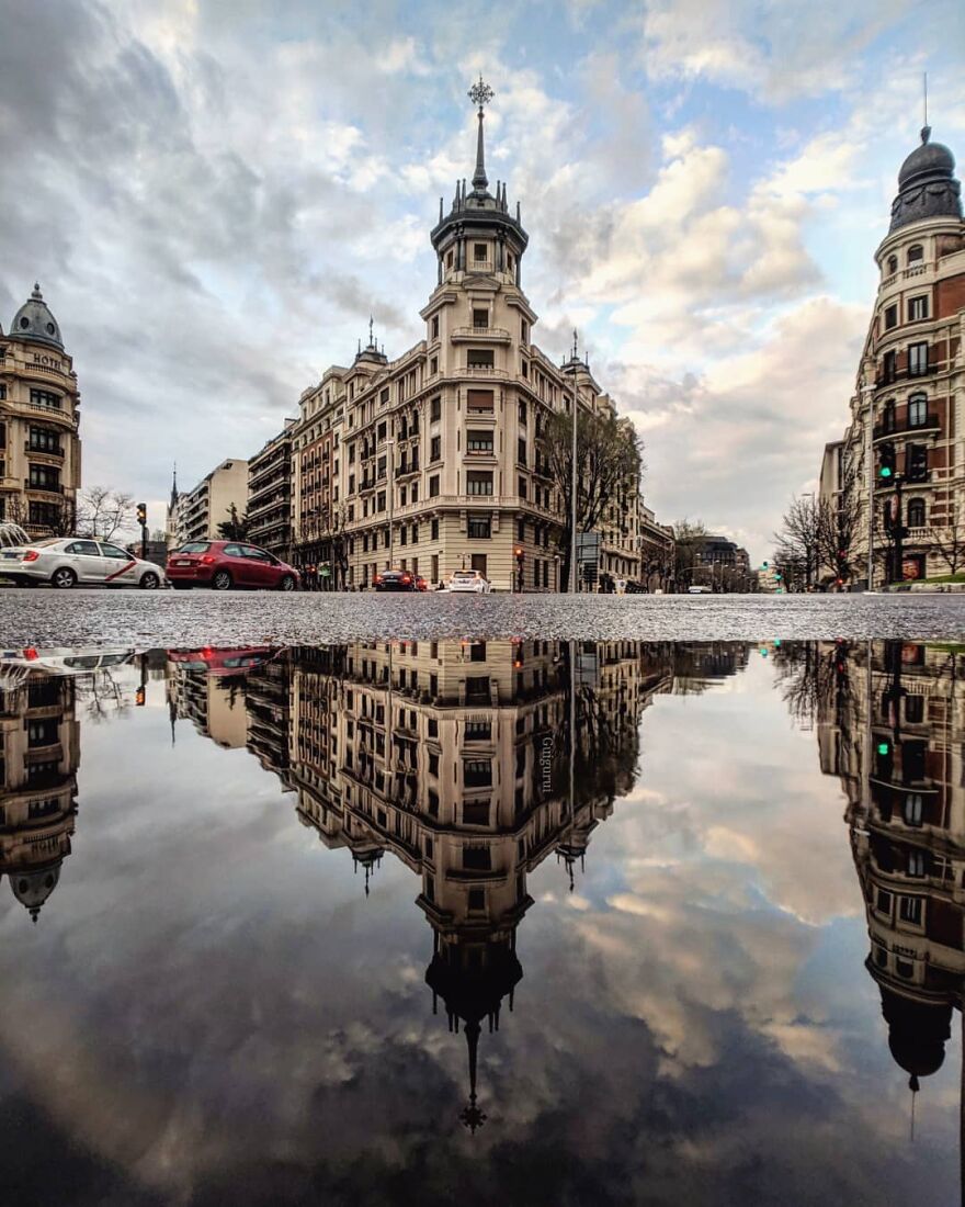 Unusual Pictures Of The Beauty Of Madrid Through Reflections And Puddles