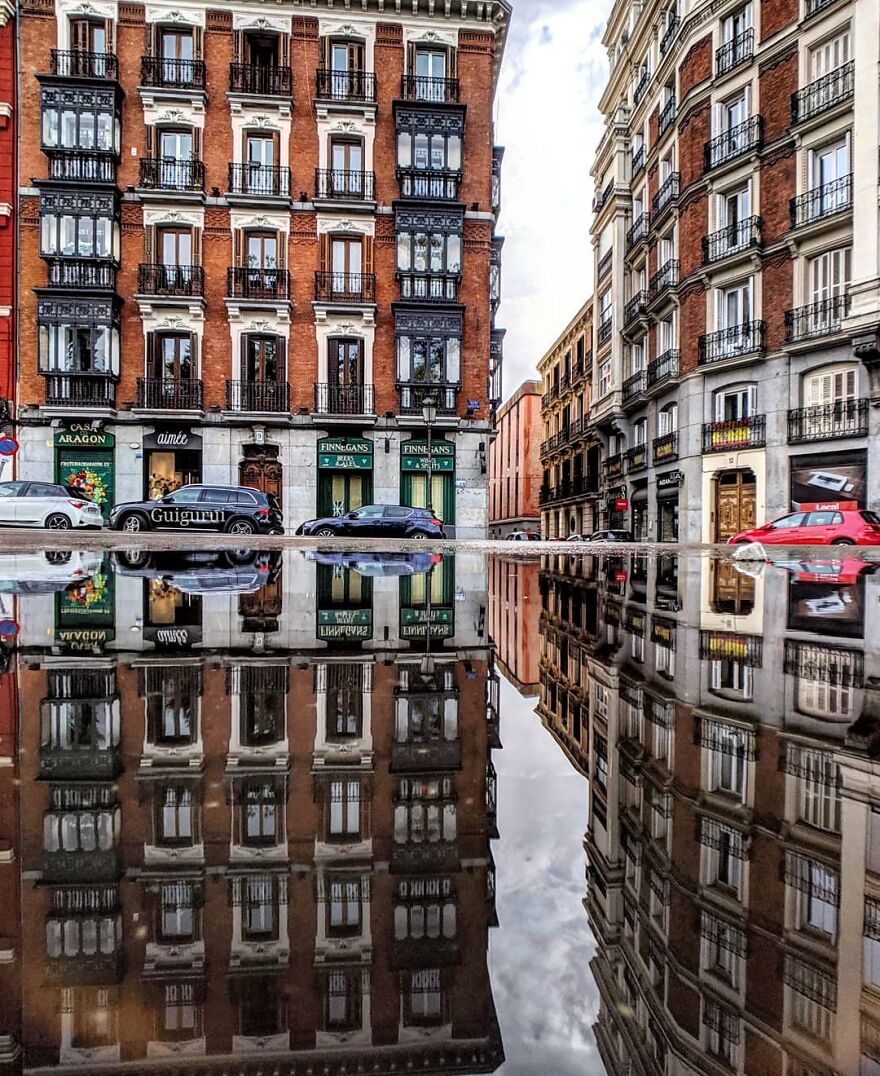 Unusual Pictures Of The Beauty Of Madrid Through Reflections And Puddles