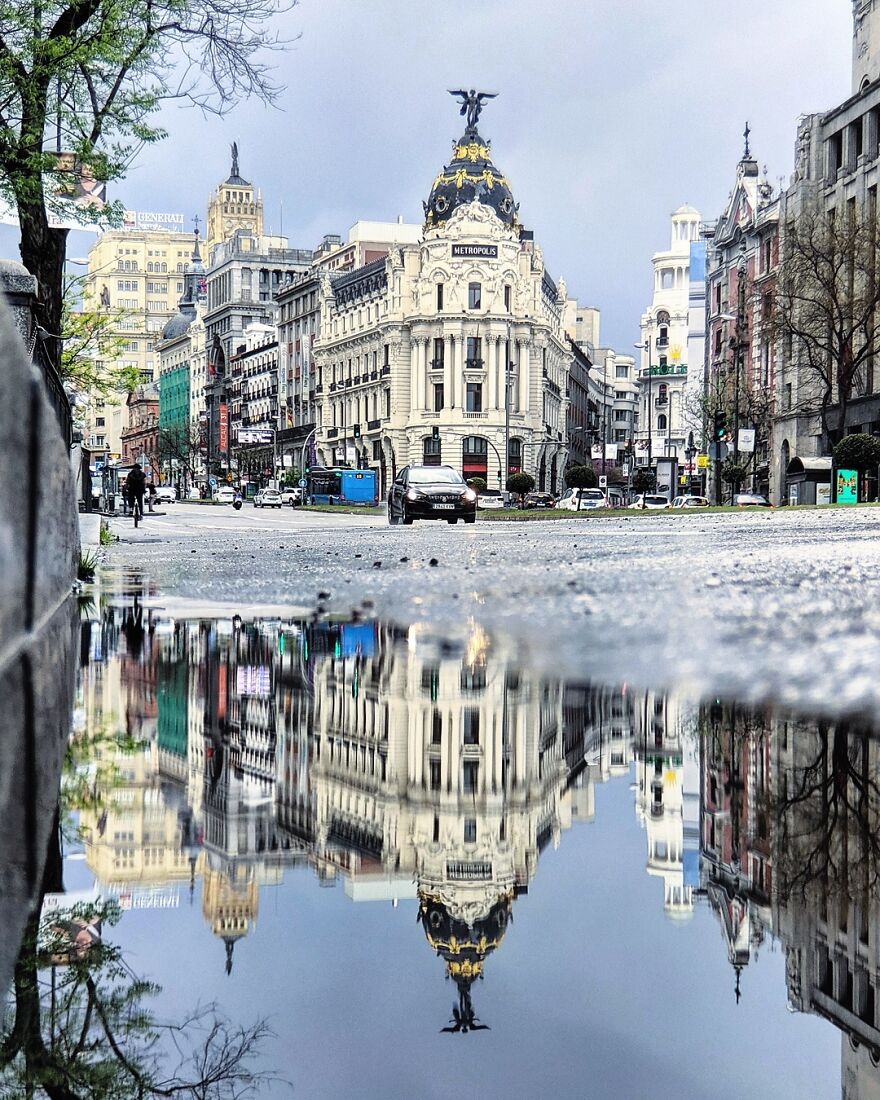 Unusual Pictures Of The Beauty Of Madrid Through Reflections And Puddles