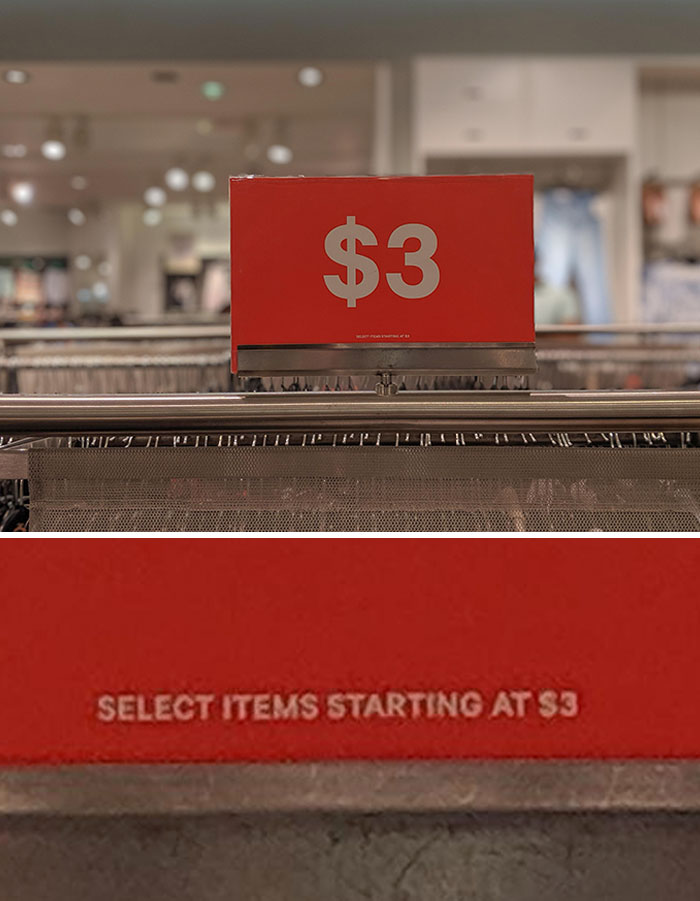 Red $3 price sign in a store showcasing an example of evil marketing techniques used to attract customers.