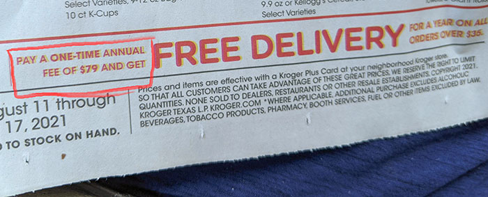 Close-up of an advertisement with misleading free delivery offer illustrating evil marketing techniques used by businesses.