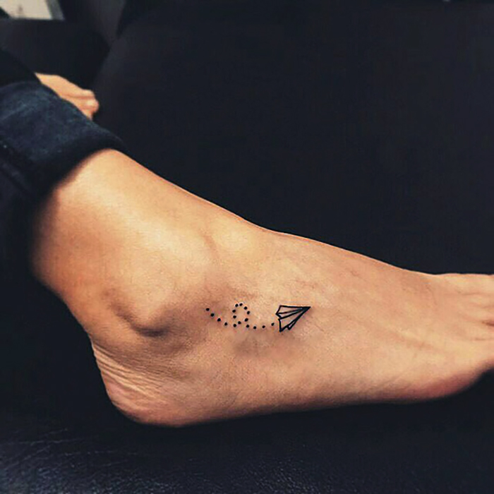 Paper Plane Foot Tattoo