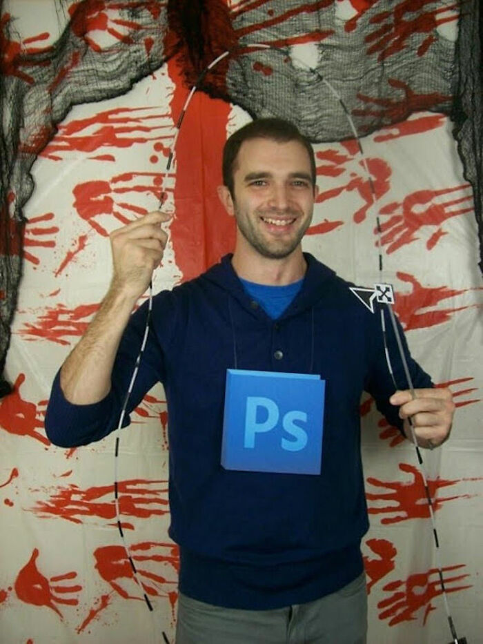 Man in a simple Halloween costume with Photoshop logo and selection tool props, showing creative low-effort costumes.