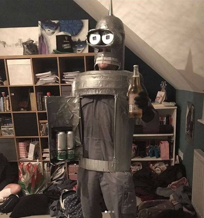 Person in a creative Halloween costume made with duct tape and cans, showing a low effort but great result costume idea.
