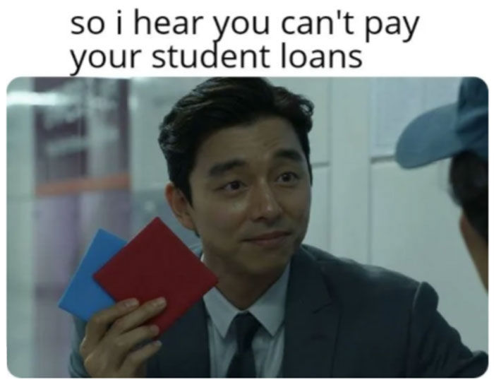 Man from Squid Game jokingly offers red and blue cards, referencing student loans.