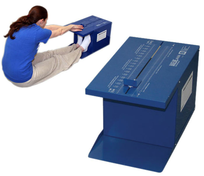 Woman in a blue shirt using a sit and reach box, a popular fitness test from the 2000s.