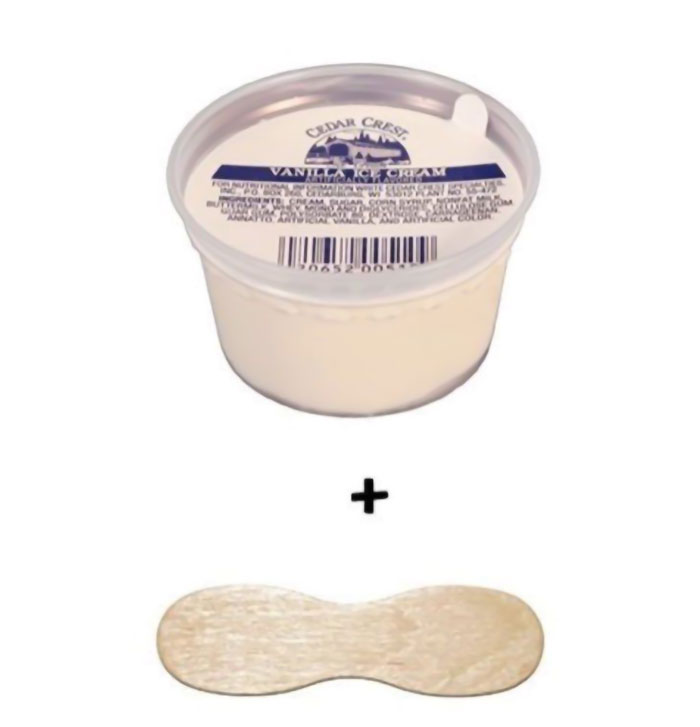 Small vanilla ice cream cup with wooden spoon, a nostalgic treat from the 2000s.