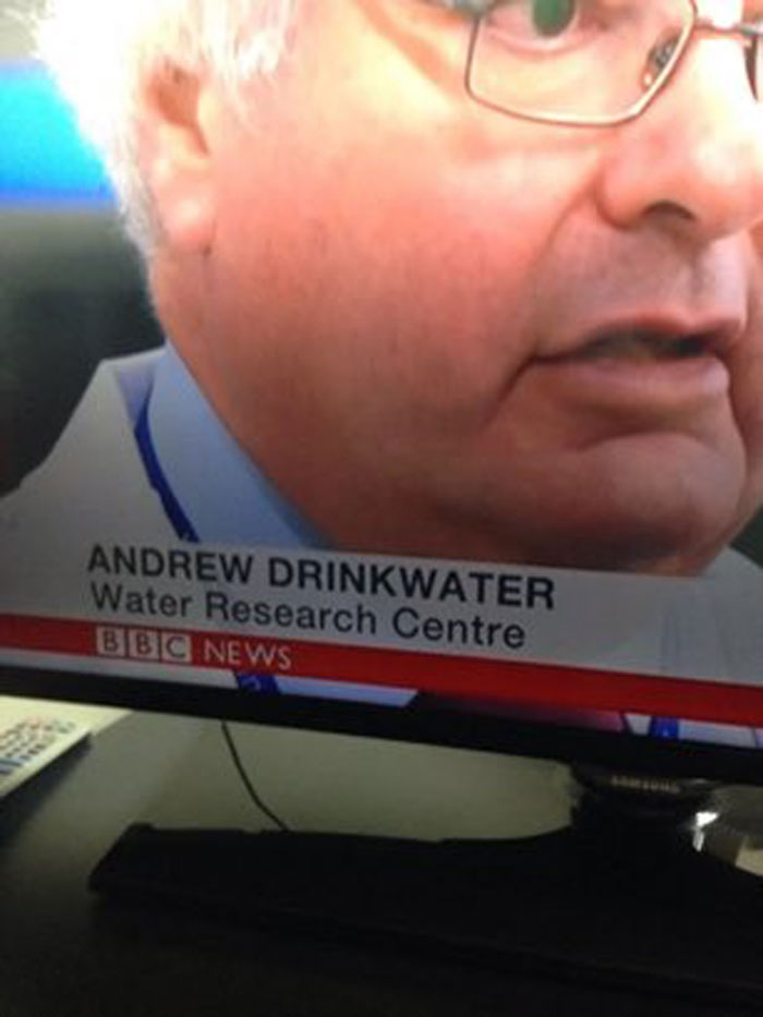 Person labeled Andrew Drinkwater on TV screen with Water Research Centre caption, related to memes about drinking water.