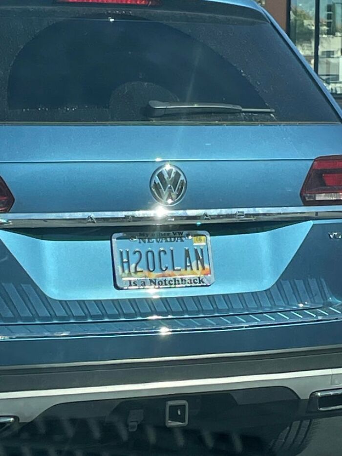 Blue Volkswagen with "H2OCLAN" license plate, humor related to drinking water.