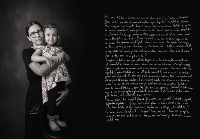 Black and white photo of a woman holding a child, illustrating the emotional challenges of postpartum motherhood.