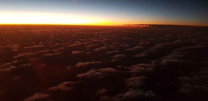 Sunset Above The Clouds Over Sahara Desert