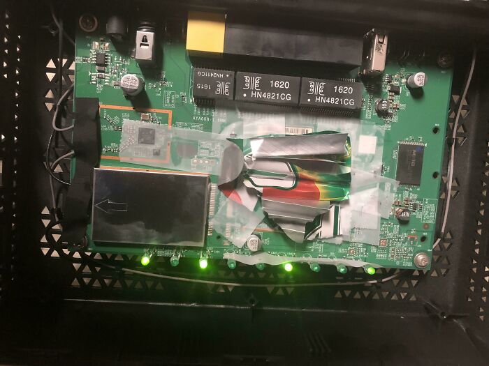 Second Hand Router I Bought Ran Too Hot. A 7-Up Can, Tape, And Toothpaste Solved The Issue