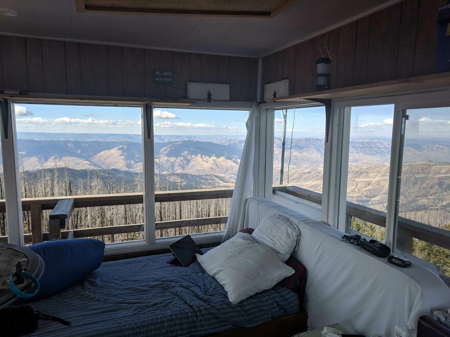 Beautiful scenery through cabin windows overlooking a mountainous landscape.
