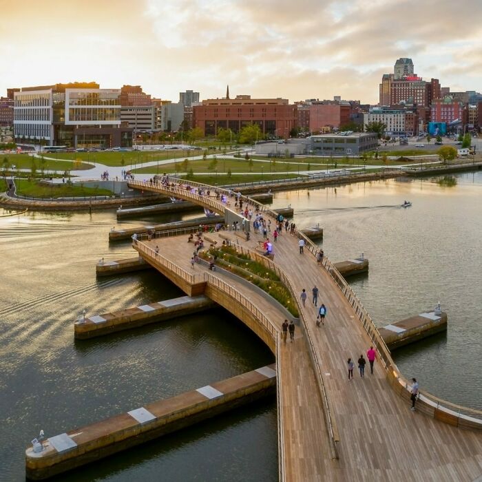 Curved Pedestrian Bridge Links Two Riverfront Parks In Providence, Rhode Island