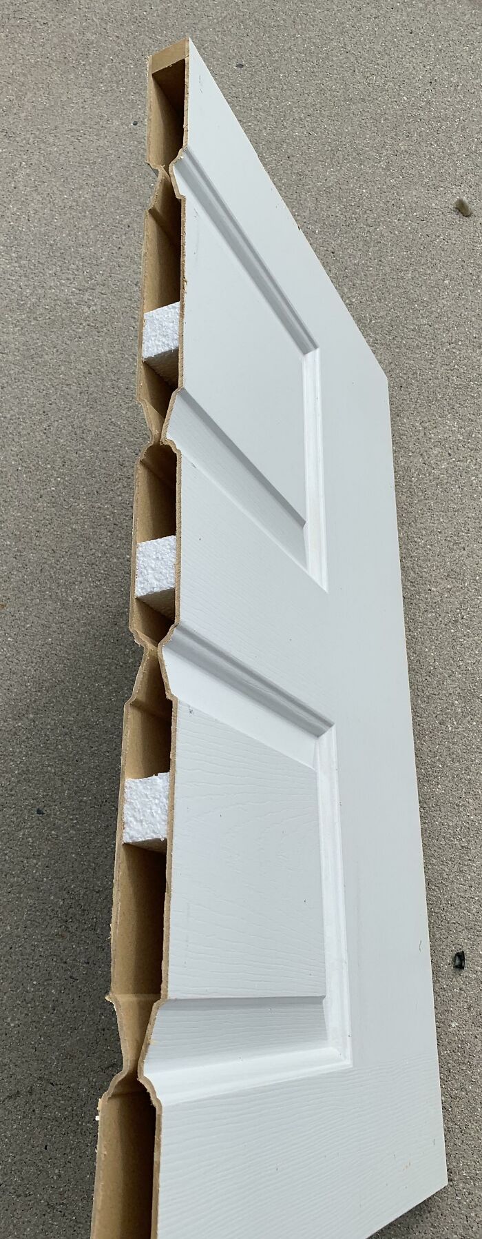 Hollow modern home door panel with foam inserts, showing one of the most annoying modern home trends in construction quality.