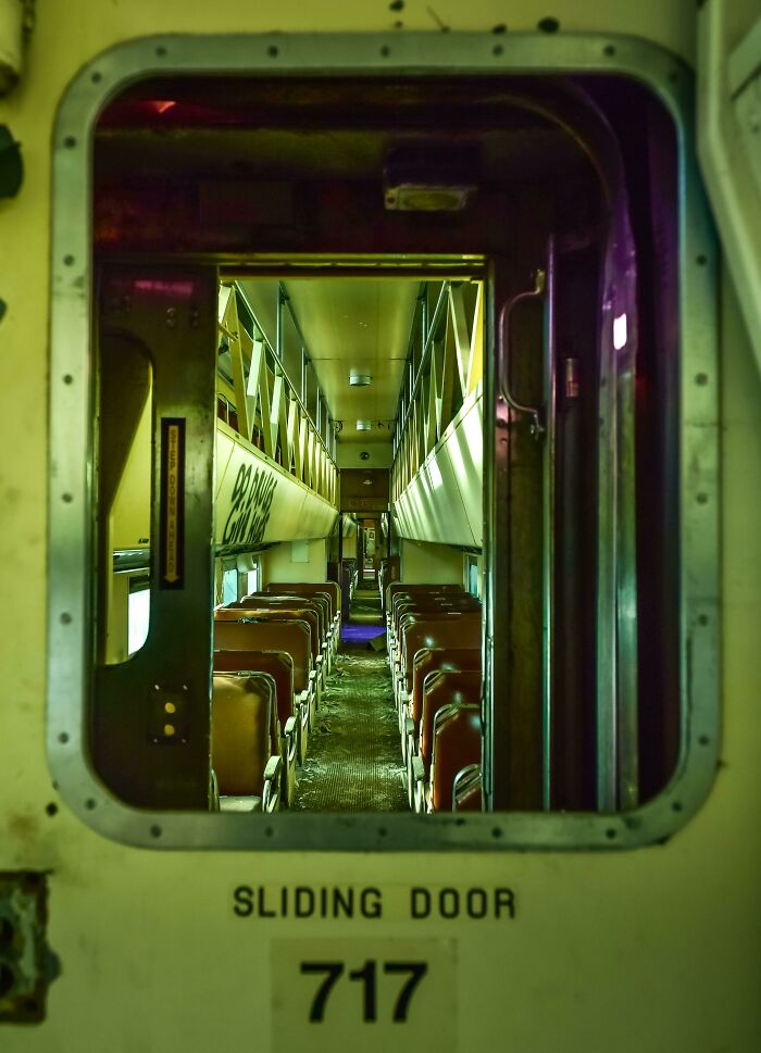 Looking Between The Doors Of 2 Passenger Rail Cars. It Went On Forever, 24 Cars In Total. The Green Is Due To Tinted Windows