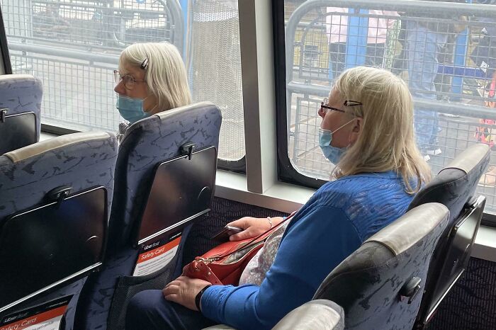 Two Women With Same Mask, Similar Clip And Hair