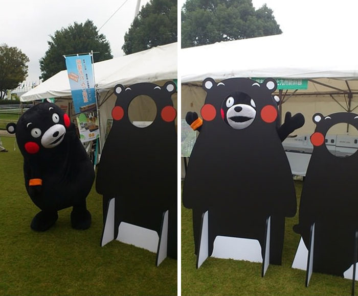 Japanese Mascot Kumamon Putting His Face Through His Own Cutout