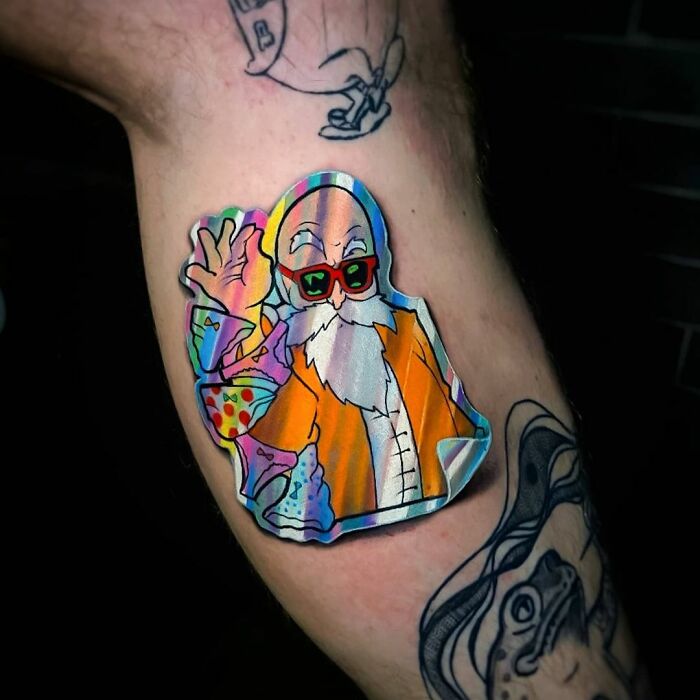 Holographic sticker tattoo of a cartoon character, featuring vibrant colors and an optical illusion effect.