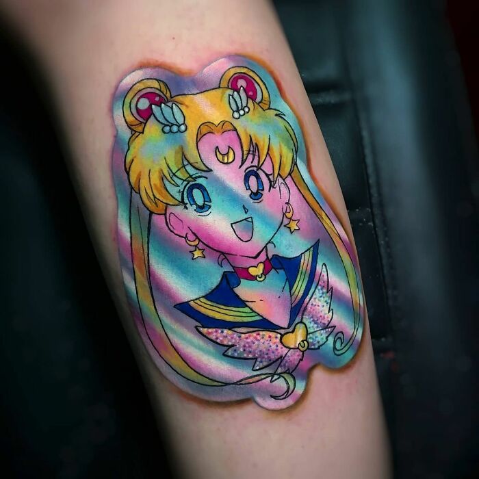 Holographic sticker tattoo of an animated character by a Brazilian artist, featuring vibrant colors and playful design.