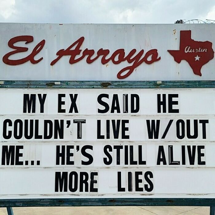 Restaurant sign with funny text about an ex's untruthful statement, showcasing humorous signage.