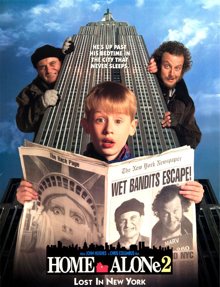 Child holding newspaper in front of skyscraper for a popular Christmas movie poster.