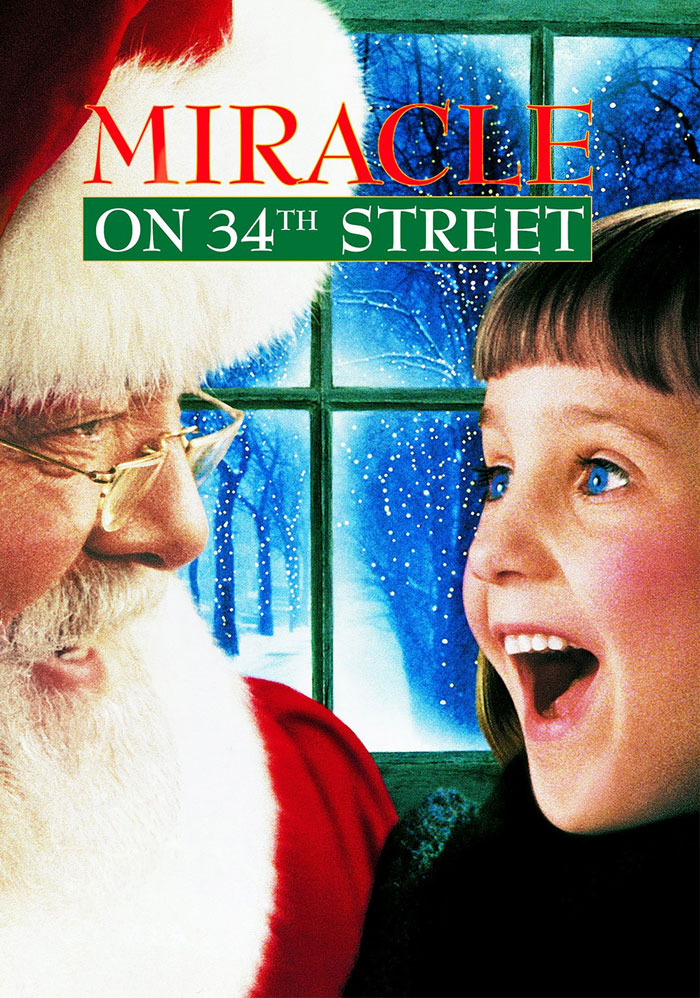 Santa and a joyful child in a scene from a classic Christmas movie.