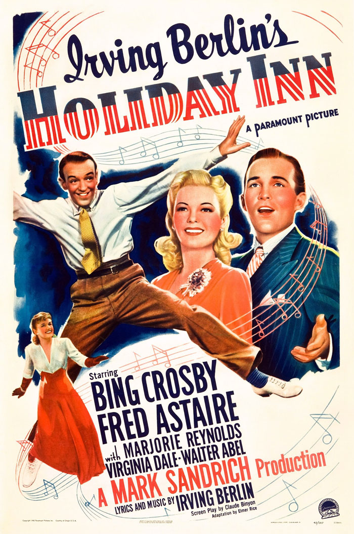Poster for "Holiday Inn," a classic Christmas movie featuring musical notes and dancing figures.
